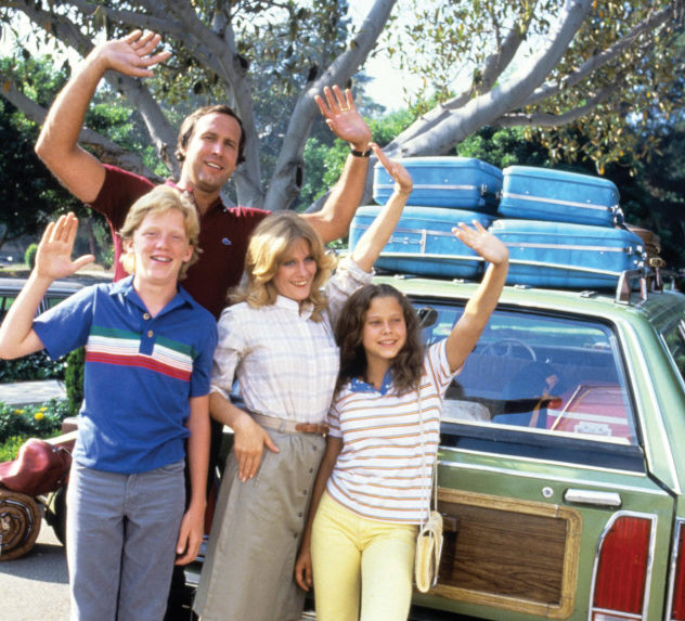 The cast of "National Lampoon's Vacation waving in front of their station wagon.