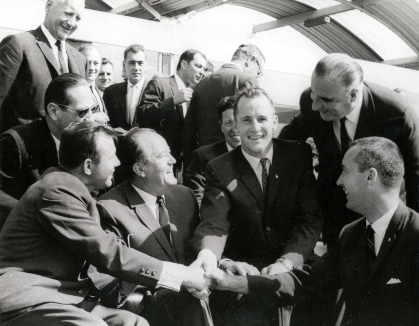 Soviet cosmonaut Yuri Gagarin seen shaking hands with the crew of Gemini 4, in 1965