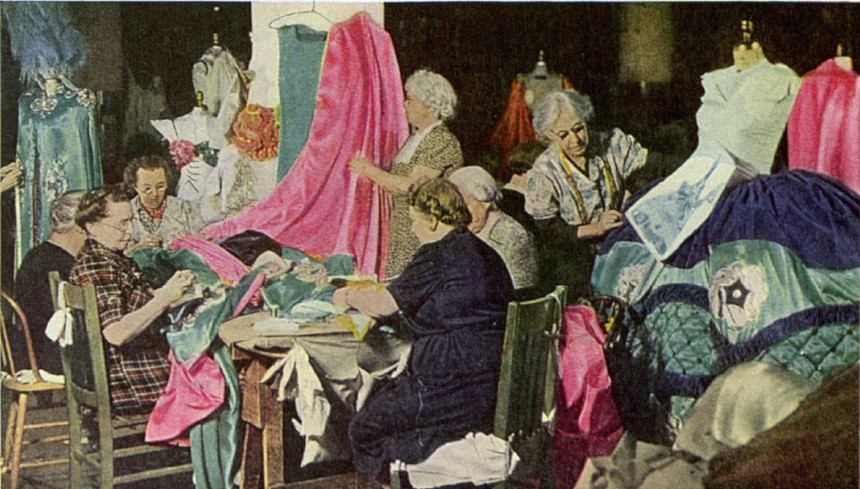 Women sewing clothes for a musical.