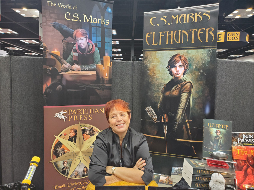 Fantasy author C.S. Marks at a Gen Con booth