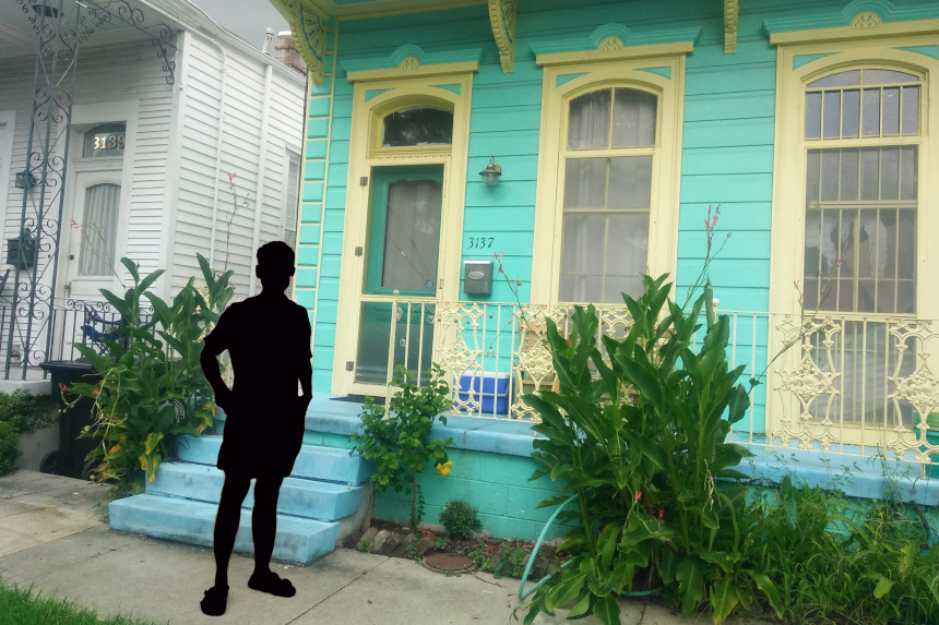 A silhouette in front of a porch.