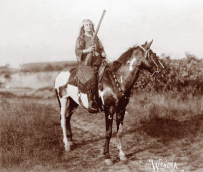 Lillian Smith, as Wenona, on a horse.