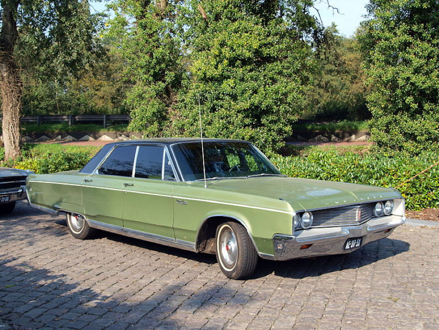 A Chrysler Newport on a brick driveway