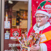 A festive statue of KFC founder, colonel Sanders, outside of an Osaka, Japan restaurant.