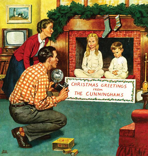 A father and mother takes a Christmas photograph of their children. Their son shows his displeasure as sits next to his patient sister.