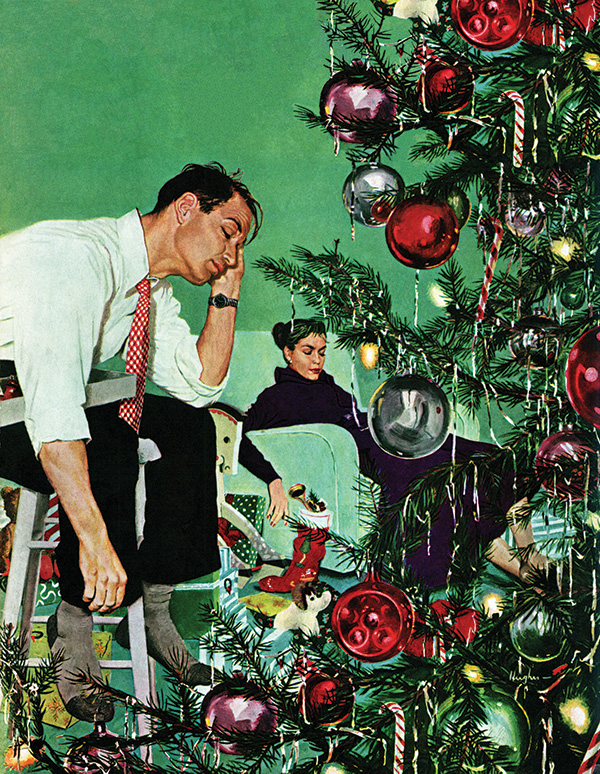 An exhausted couple rest in front of the Christmas tree they'd just decorated.
