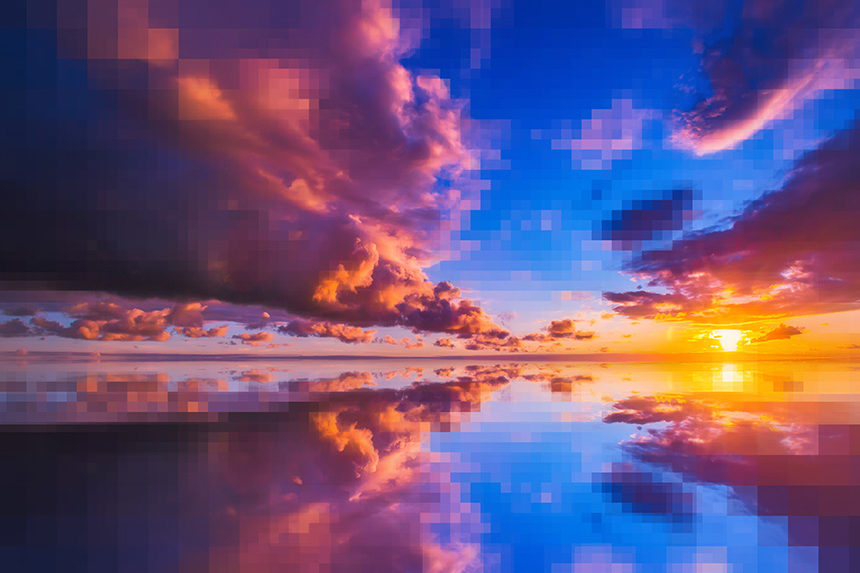 A sunrise over a body of water. Parts of the image are pixelated.