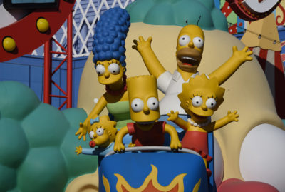 Statue of the Simpsons family riding a roller coaster car.