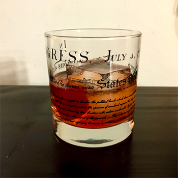 A shot glass of Old Fashioned