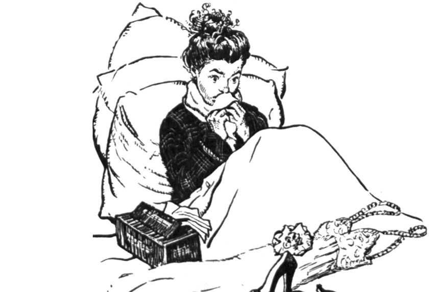 Woman sitting in bed, wiping her nose. She is dealing with the common cold.