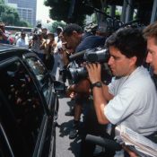 Reporters swarm O.J. Simpson's motorcade during his pre-trial in 1994,