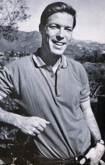 Actor Richard Chamberlain poses for a photo in front of a mountain range.