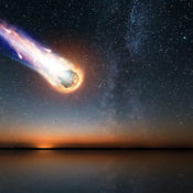 A computer-generated image of a burning meteor plummeting towards a body of water at dusk.