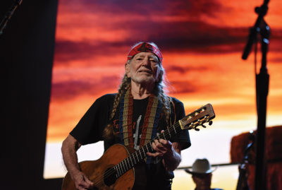 Country music superstar Willie Nelson performs on stage during a Farm Aid concert.