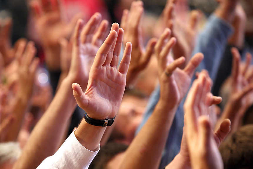Hands raised during an event