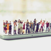 Figurines of angry people on a mobile phone