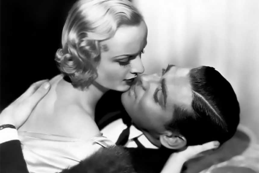 Carole Lombard leaning in to kiss co-star, and off-screen lover, Clark Gable in the film "No Man of Her Own"