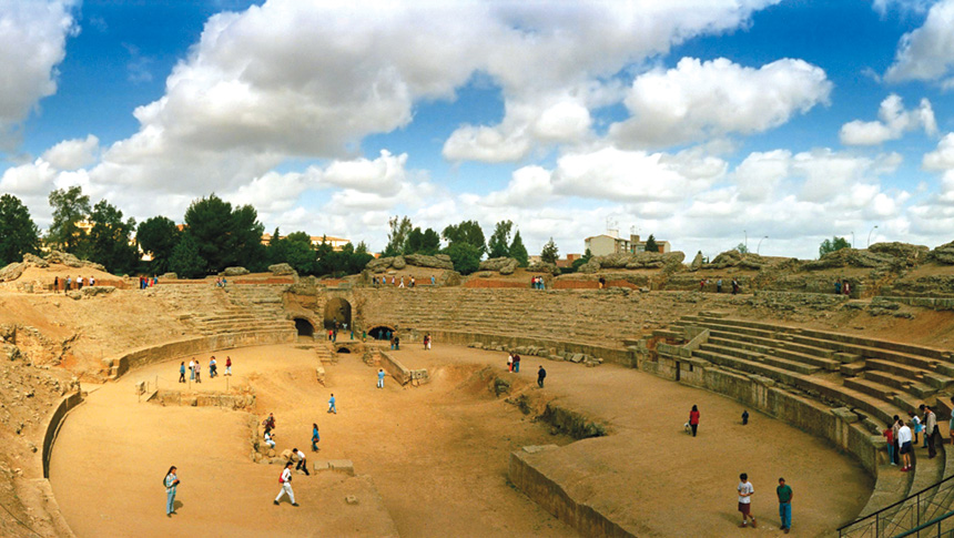 Tourists explore an ancient amphitheater 