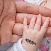Baby hand with a barcode on it.