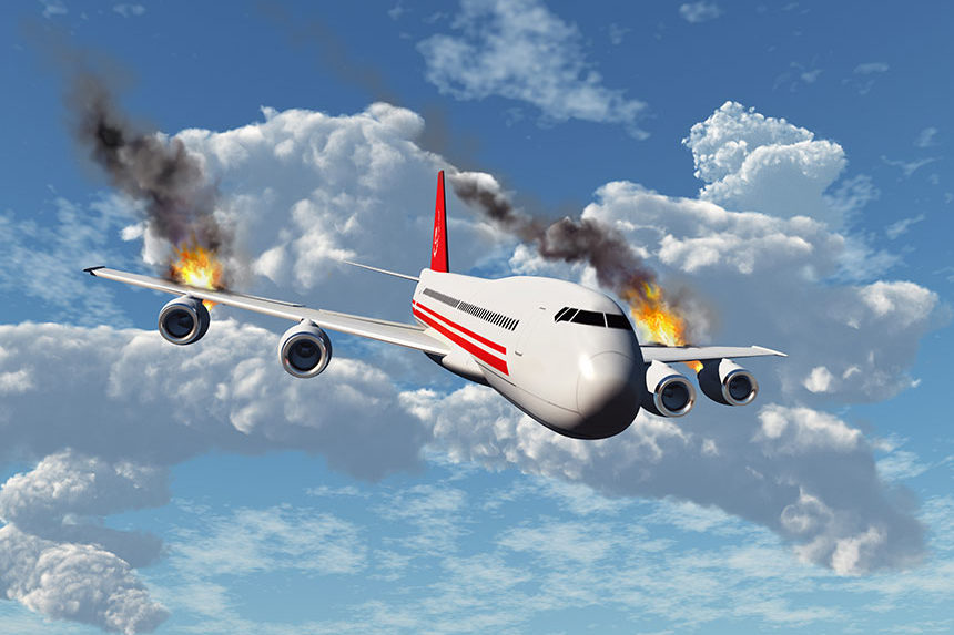 A airline jet on fire as it descends from the sky.