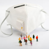 Surgical mask surrounded by little figures