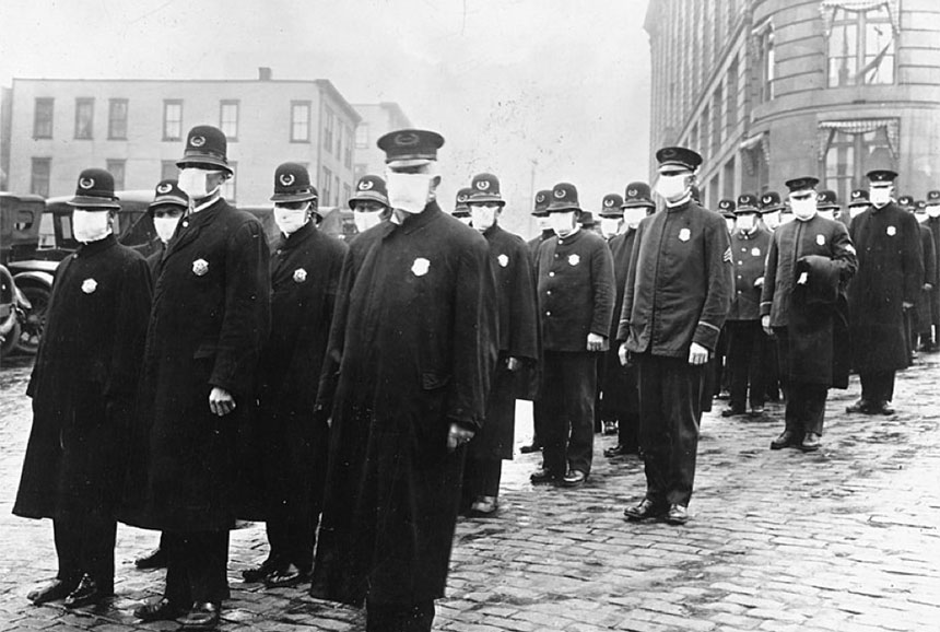 A large group of policemen wearing surgical masks