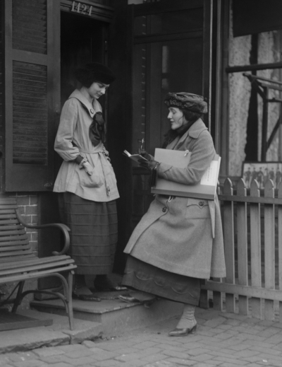 A census taker interviews a resident during the 1920 U.S. Census