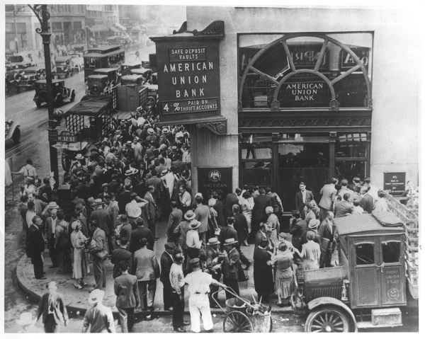 A large crowd file into a bank in a desperate attempt to pull funds during the 1932 bank runs.