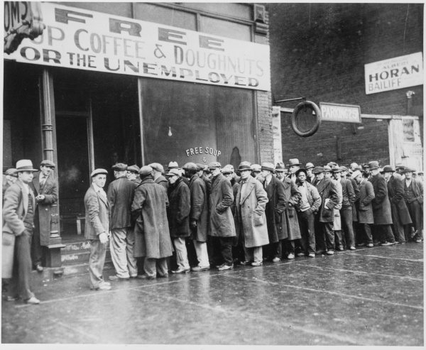 Unemployed workers queue in front of a Chicago soup kitchen