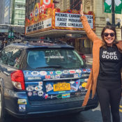 Mary Latham waves next to her car.