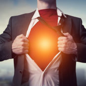 Man takes off his business suit, not unlike Superman