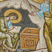 Ancient religious art of a scribe writing something down in a book
