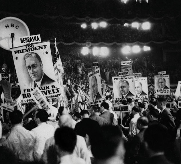 People cheering at a rally for FDR