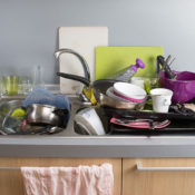 Stacks of dirty dishes in a sink