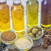 Bottles of oils and bowls of seeds