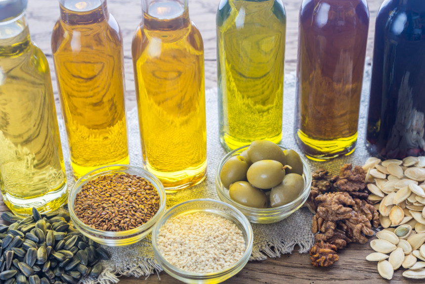 Bottles of oils and bowls of seeds