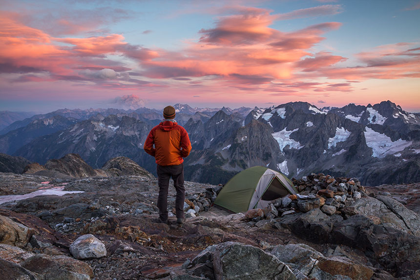 Man standing on a mountain ledge in North Cascades National Park