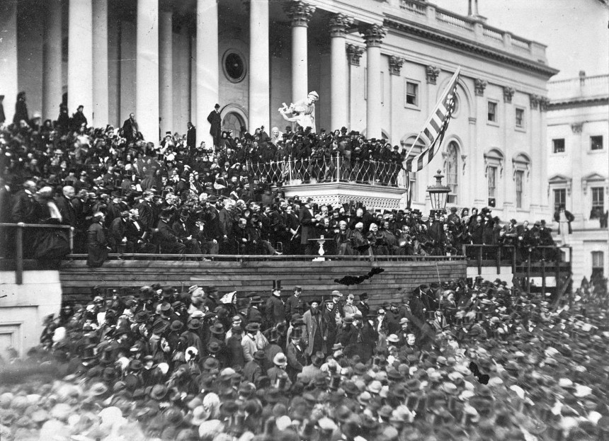 Crowd of people gather in front of the U.S. Capitol building to hear Abraham Lincoln give his second inaugural address