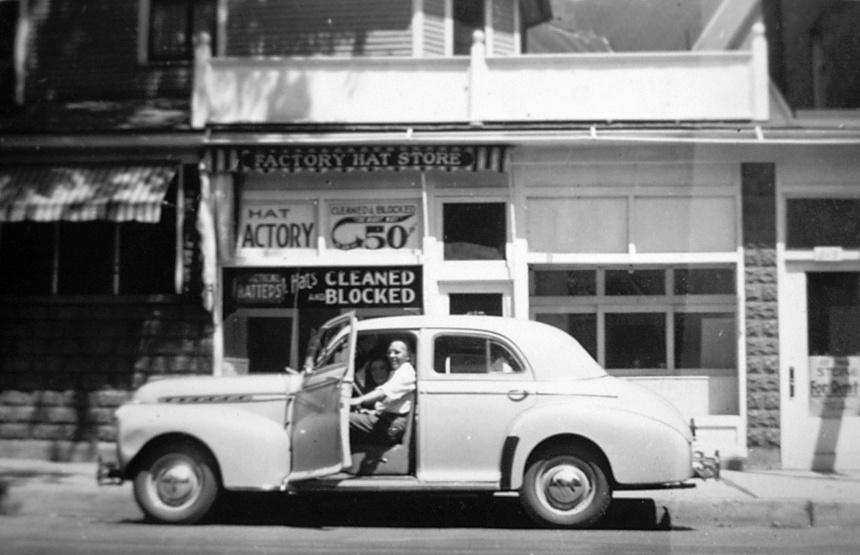 Val Lauder's dad can be seen in a car that's parked in front of a store.