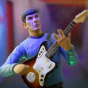 A Mr. Spock Star Trek toy holding a guitar while giving the Vulcan Salute.