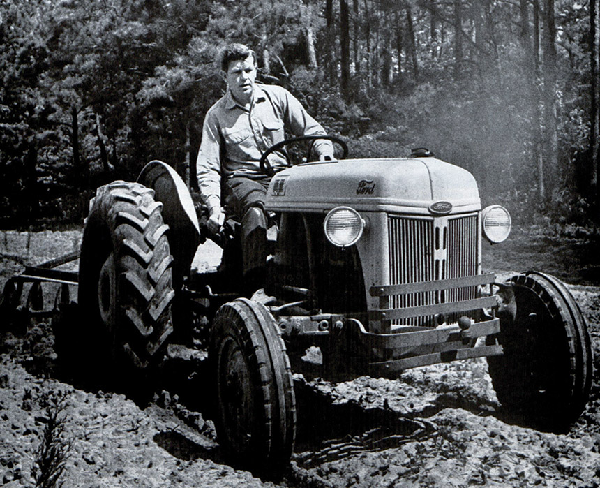 Andy Griffith driving a tractor