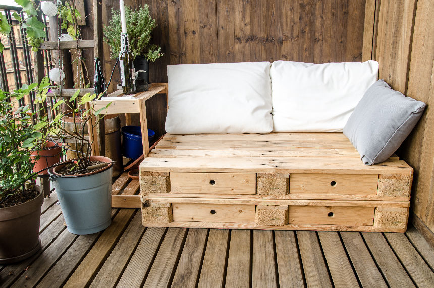 Wooden pallet bed on a balcony