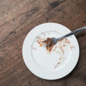 Dinner plate with cake crumbs on it