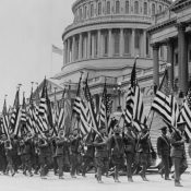 Veterans of World War I march in front of the U.S. capitol building demanding promised bonus payments for their service, in 1932.