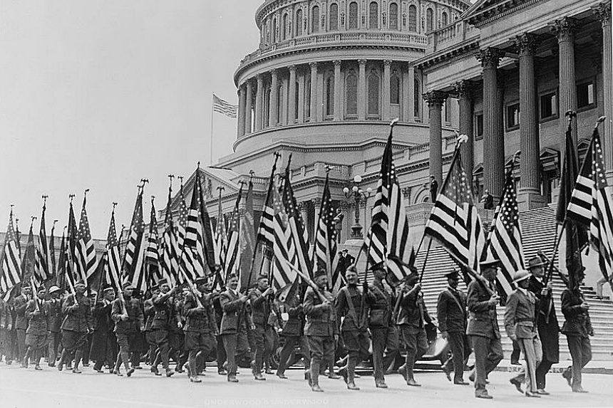 Veterans of World War I march in front of the U.S. capitol building demanding promised bonus payments for their service, in 1932.