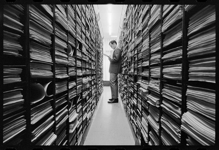 U.S. Patent Office employee perusing patent records