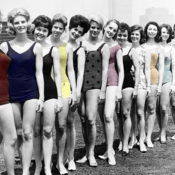 Female students of a charm school pose for a photograph in their bathing suits.