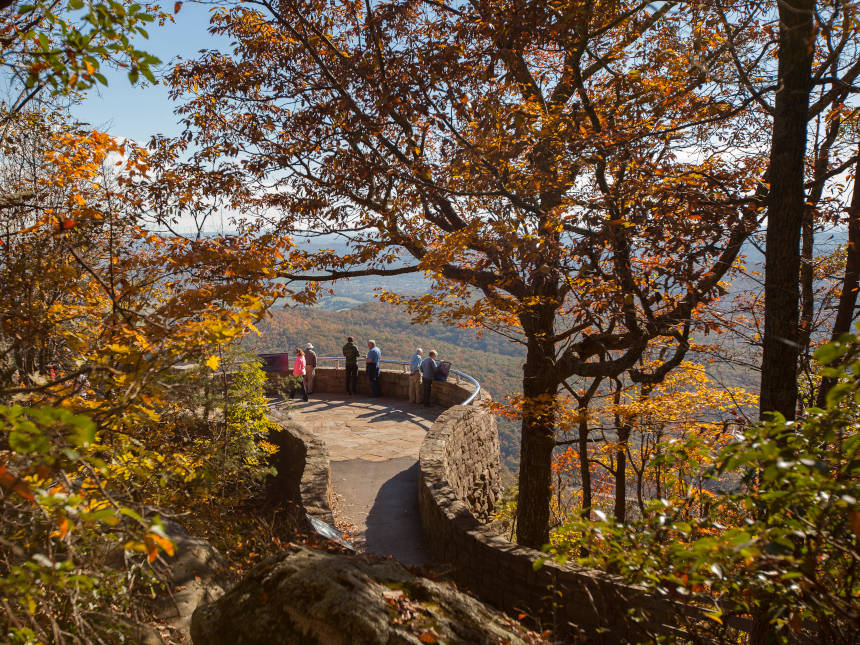 Tourists looking at wooded mountains in Kentucky