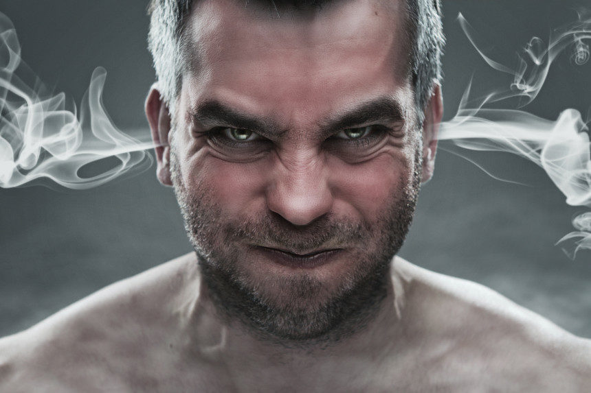 An angry man with steam coming out of his ears.