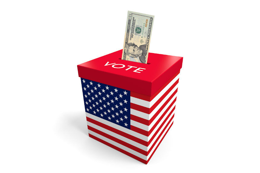 An American dollar being pushed into a voting box